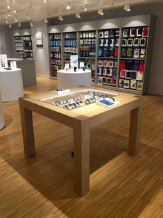 a wooden table sitting inside of a store