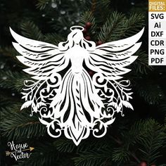 a white angel ornament hanging from a christmas tree