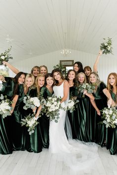 a group of women in green dresses holding bouquets