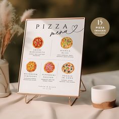 a pizza menu sitting on top of a table next to a vase with flowers in it