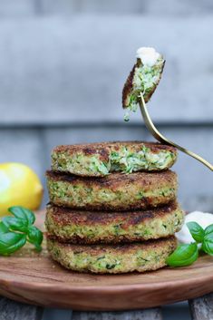 a stack of food on top of a wooden plate