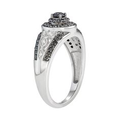 Add a unique accessory to your jewelry collectionw with this black and white diamond and filigree ring. Click on this JEWELRY & WATCHES GUIDE to learn about fit, styles, materials and more!RING DETAILS Width: 7.75 mm. Metal: sterling silver Plating: rhodium Finish: polished DIAMOND DETAILS Total carat weight: 1/4 ct. Center stone weight: 1/6 ct. Shape: round Color: black, white Color grade: H,I Clarity: I2,I3 Setting: prong Diamond weights are approximate. Diamond total weights may vary between Styles Women, Right Hand Rings, Filigree Ring, Accessories Unique, White Silver, Black Diamond, White Diamond, White Black, Jewelry Watches