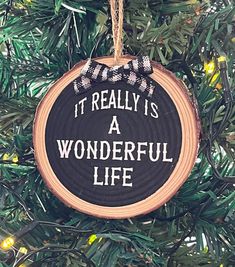 a christmas ornament hanging on a tree with the words it really is a wonderful life