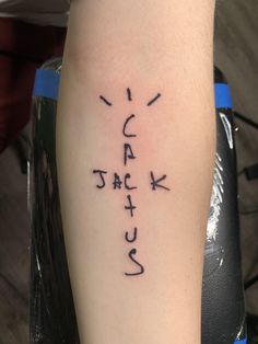 a person with a tattoo on their arm that has japanese characters written in cursive writing