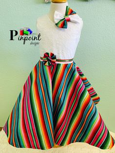 absolutely stunning toddler dress. Perfect for a fiesta party. It features a white lace material on the top and the skirt out of a very colorful serape material. Under the skirt it has some horsehair brother braid which make it a little puffy. So adorable ! I also made a perfect hair bot to match it. This dress is made out of the best quality materials, in a pet and smoke free shop. I do all my work in a smoke and pet free shop. I'm also attaching pictures of my work shop so you can see where yo Fitted Multicolor Dress For Cinco De Mayo, Multicolor Summer Dress For Pageant, Multicolor Summer Pageant Dress, Multicolor Dress For Cinco De Mayo Fiesta, Multicolor Fiesta Dresses, Fiesta Dresses With Ruffles, Ruffled Dresses For Fiesta, Fiesta Multicolor Ruffled Dresses, White Dresses For Cinco De Mayo Fiesta