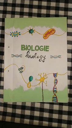 a sign that is on top of a checkered table cloth with the words biology written in it