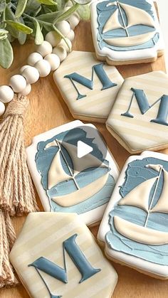 decorated cookies with blue and white sailboats on them