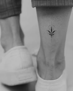 a person with a small tattoo on their foot