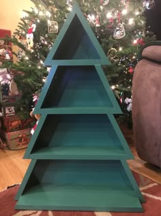 a christmas tree made out of wooden shelves