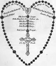 a rosary with the names of jesus and mary on it in an ornate heart - shaped frame