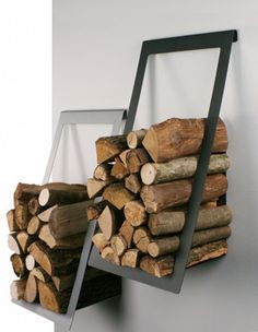 a stack of firewood sitting on top of a shelf next to a pile of logs