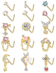 six pairs of gold plated metal ear clips with crystal stones and stars on them