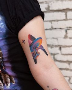 a person with a colorful tattoo on their arm