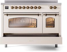 an old fashioned white oven with brass knobs