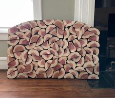 a pile of logs sitting on top of a hard wood floor