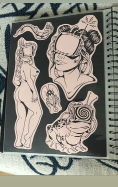 some stickers on top of a book with an image of two women and one man