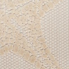 an area rug with white and beige colors