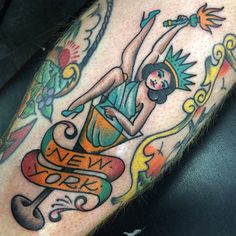 a tattoo on the leg of a person with a skateboard