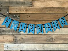 a blue banner that says,'futuranado'hanging on a wooden wall