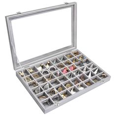 an open jewelry box filled with lots of rings