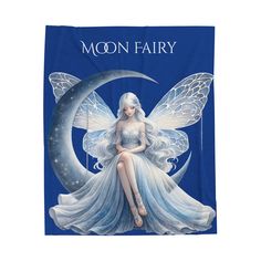 a blue towel with a fairy sitting on the moon and writing'moon fairy '