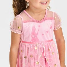 Add a whimsical touch to your kids' PJ wardrobe with this Wicked Glinda Dress-Up Nightgown. Made from lightweight knit fabric, this pink dress-up nightgown is designed to look like Glinda's dress from the Wicked musical. Featuring a regular fit and an easy pullover style, it'll help your kid stay comfy as they lounge around the house or wind down for bed. Glinda Dress, Wicked Glinda, Wicked Musical, Princess Dress Up, Disney Frozen Elsa, Disney Girls, Toddler Girl Outfits, Lightweight Knit, Princess Dress