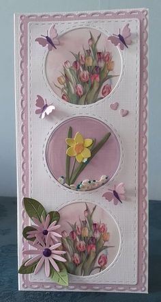 a card with flowers and butterflies on it