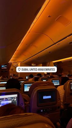 the interior of an airplane with many computers and monitors on each side of the seats