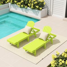 two lawn chairs sitting next to a pool with yellow flowers in the backgroud