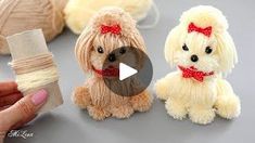 someone is holding two small stuffed dogs in their hands and they are all made out of yarn