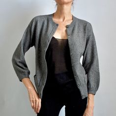 In Mint Condition. 100% Cashmere Charcoal Gray Cardigan With 2 Pockets At Front. Mother Of Pearl Buttons. 3/4 Wide Sleeve Super Soft Cashmere, Medium Knit. Measurements Flat On Table: Bust: 16" Inches Length: 21" Approx. Sleeve Length From Shoulder: 18"Inches Elegant 3/4 Sleeve Cardigan For Layering, Elegant Cardigan With 3/4 Sleeves For Layering, Elegant Fitted Sweater With Pockets, Elegant Cardigan With Pockets For Daywear, Elegant Daywear Cardigan With Pockets, Elegant Layering Cardigan With Pockets, Gray Cardigan, Grey Cardigan, Cashmere Cardigan