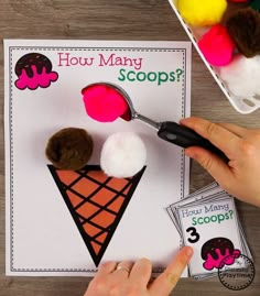 someone is making a scoop of ice cream with pom - poms on it