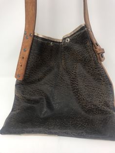 "Purchased in California at a swap meet, repurposed handmade bag used one time! strap is 1 1/4\"wide/strap drop 11\"/height 12\"/Length 11\"/smoke free environment/top closure two snaps(45)" Vintage Hobo Satchel Bag For Everyday, Vintage Satchel Hobo Bag, Vintage Everyday Hobo Bag Shaped As Satchel, Vintage Satchel Hobo Bag For Everyday, Vintage Everyday Hobo Bag, Vintage Square Satchel With Adjustable Strap, Rustic Brown Bags With Leather Handles, Vintage Hobo Bag With Leather Backing For Travel, Vintage Leather-backed Hobo Bag For Travel