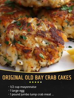 crab cakes are served on a plate with lemon wedges