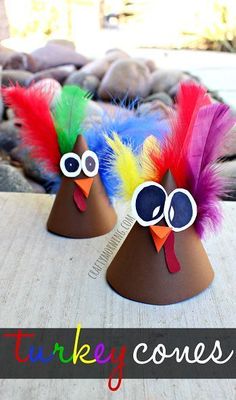 two turkey cones with colorful feathers on them