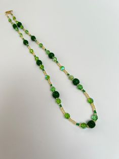 Pretty Green Glass Bead Necklace - Etsy 日本 Green Beaded Chain Jewelry, Green Crystal Necklaces With Colorful Round Beads, Green Necklaces With Gold Beads For Jewelry Making, Green Czech Glass Beaded Chain Jewelry, Green Beaded Czech Glass Jewelry, Green Czech Glass Jewelry With Beaded Chain, Green Jade Beaded Chain Jewelry, Handmade Adjustable Green Emerald Necklace, Gold Beaded Jade Necklace