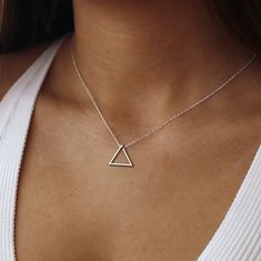 "Triangle Necklace, 925 Sterling Silver Triangle Necklace, 14K Gold Triangle Necklace, Minimalist Triangle Necklace, Geometric Pendant  ♡ Triangle Necklace ♡ Welcome to my shop, All our produtcs handmade with love. Handmade silver necklace is a very nice and dainty gift that you can buy for your loved ones or yourself.  We are happy to create a design on the necklace with your name or special names for you.  ♡ Materials: High Quality 925 Sterling Silver, Gold Plated Silver and Rose Gold Plated Silver ♡ All necklaces will be carefully packaged and sent in a special gift box. I hope you can find your personalized necklace that suits you in our store. For other samples, please visit our store. ♡ HOW TO ORDER ♡ 1- Choose Color and Option  2- Choose necklace length. Standard 16\" and for Kids 1 Gold Triangle, Triangle Necklace, Triangle Pendant, Necklace Minimalist, Geometric Pendant, Geometric Jewelry, Unique Pendant, Personalized Necklace, Gold Plated Silver