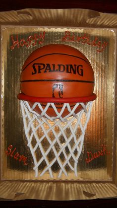 a basketball in the hoop with happy birthday written on it