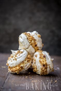 three ice cream sandwiches stacked on top of each other with crumbled toppings