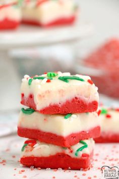 three red, white and green desserts stacked on top of each other