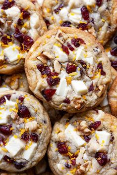 several cookies with cranberries, orange zest, and white chocolate chips on top