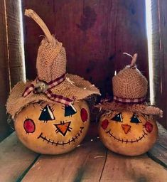 two pumpkins decorated to look like jack - o - lanterns