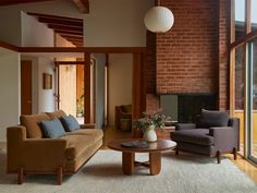 a living room filled with furniture and a fire place