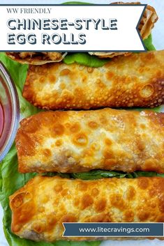 three chinese style egg rolls with lettuce and sauce