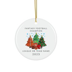 a christmas ornament with an image of a football team and trees on it