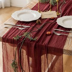 the table is set with plates and silverware for an elegant holiday dinner or special occasion