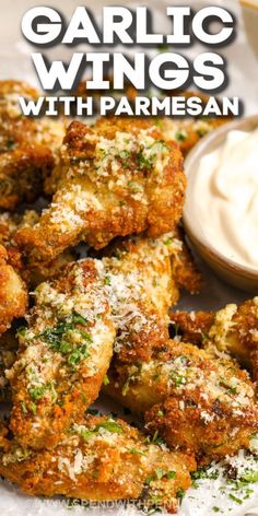 garlic wings with parmesan sauce on the side and text overlay that reads garlic wings with parmesan