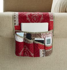 PRICES MAY VARY. 100% Polyester ORGANIZER WITH UNIQUE DESIGN: Burgundy floral and lace patchwork with heart love patterns, with double diamond quilting, elegant, exquisite and unique. Keep your accessories organized and protect your couch armrest against mess. Pets friendly. Made to enhance decor. DURABLE AND COMFORTABLE: Premium quality of quilted microfiber with extra soft fill, reverse to a white silicone puppy paw dots pattern, slip resistant and ECO friendly. Made to last. The silicone slip Couch Remote Holder, Patchwork Couch, Chair Organizer, Couch Recliner, Remote Caddy, Accessories Matching, Patchwork Sofa, Puppy Paw, Craft Fairs Booth