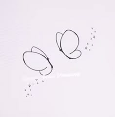 the word love is written in black ink on a white background with butterfly shaped glasses