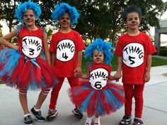 three children dressed up in dr seuss costumes